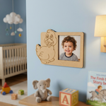 Child's photo in a MDF DIY  frame with cartoon character, nursery room with crib and toys.