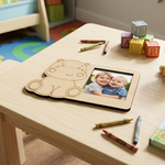 Children's MDF DIY  picture frame with a photo of two children on a table with crayons and blocks.