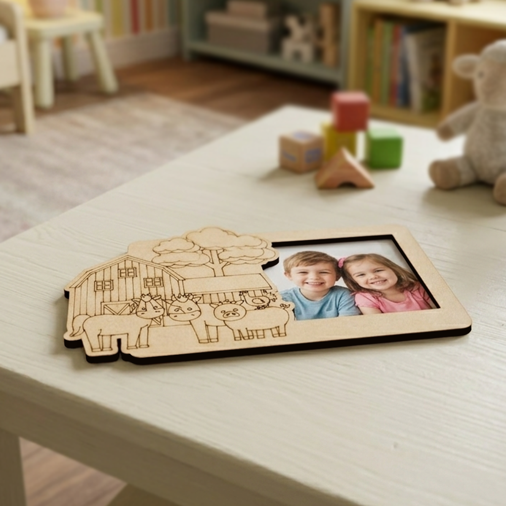 MDF DIY  photo frame with farm design and photo of two children on a table in a child's room.