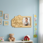 MDF DIY  picture frame with farm design on a wall with toys and a teddy bear.