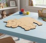MDF DIY  hippo puzzle on a children's table with toys in the background