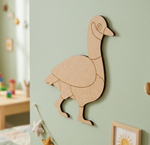 MDF DIY duck puzzle on a light green wall.