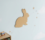 MDF DIY rabbit silhouette on a light blue wall with star decorations