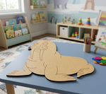   MDF DIY walrus puzzle on a blue table in a child's playroom with books and toys in the background.