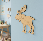 MDF DIY  moose wall decoration on a light blue wall with children's toys in the background.