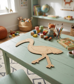 Children's playroom with a wooden table, toys, and a MDF DIY  bird-shaped puzzle.