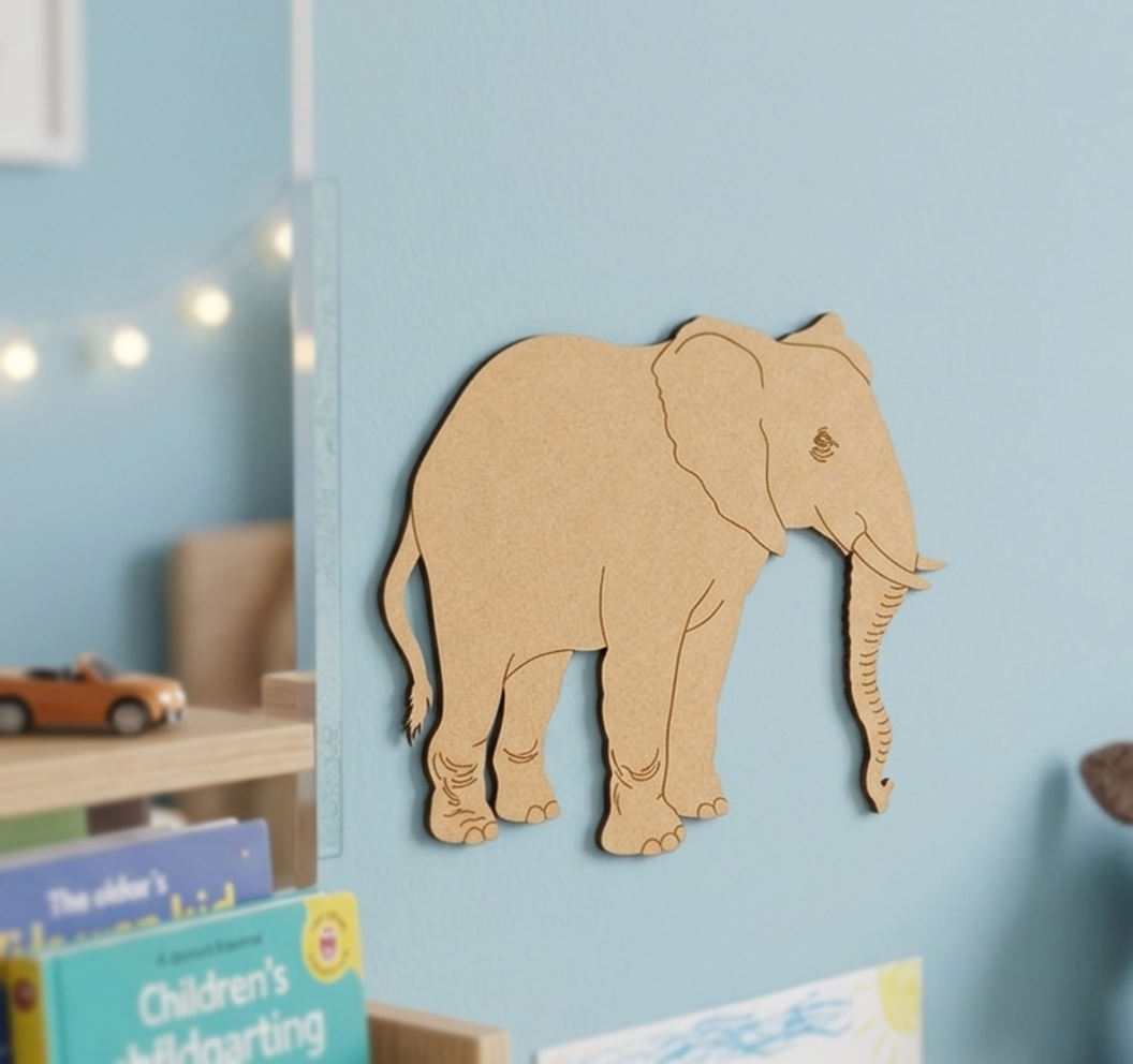 MDF DIY  elephant cutout on a blue wall with children's books below