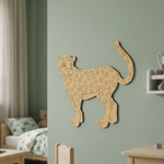 MDF DIY  cheetah wall decoration on a green wall in a child's room.