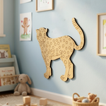 MDF DIY  leopard wall decoration in a child's room with toys and books.