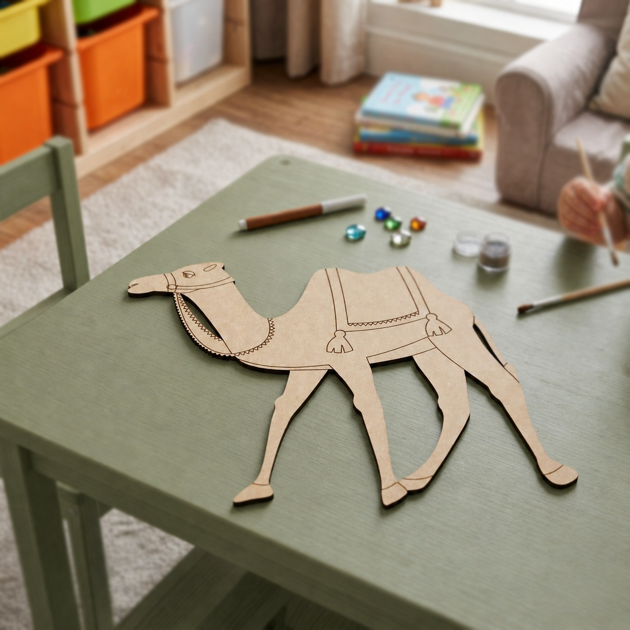 MDF DIY  camel template on a table with art supplies in a room setting