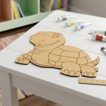 MDF DIY  turtle puzzle on a table with markers in the background
