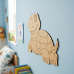 MDF DIY  turtle wall decoration on a light blue wall in a child's room.