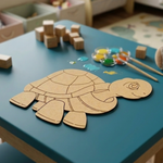 MDF DIY  turtle puzzle on a blue table with paint and brushes, surrounded by toys.