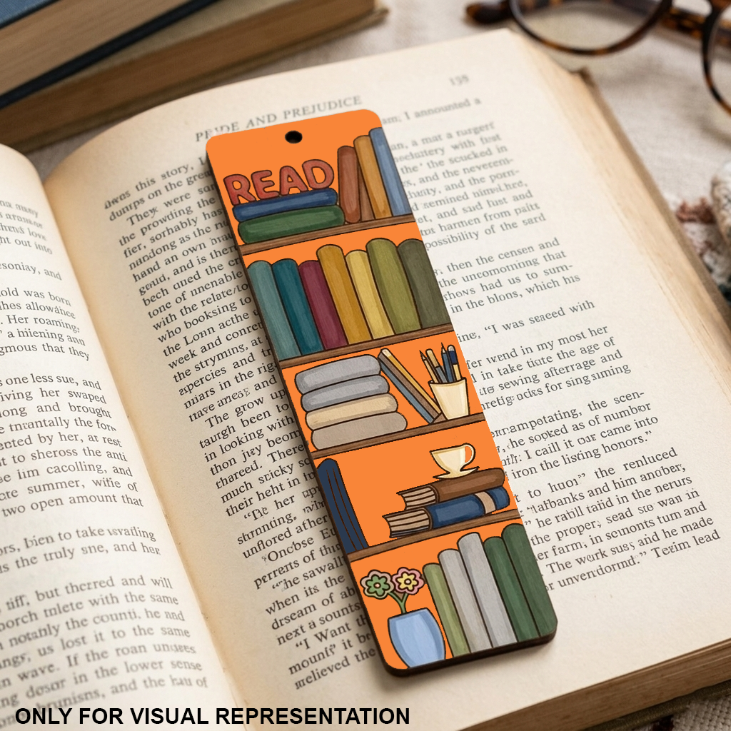 Open book with colorful MDF DIY bookmark on a wooden surface.