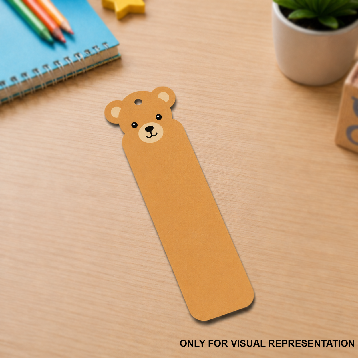MDF DIY Brown bear-shaped bookmark on a wooden surface with stationery items in the background.