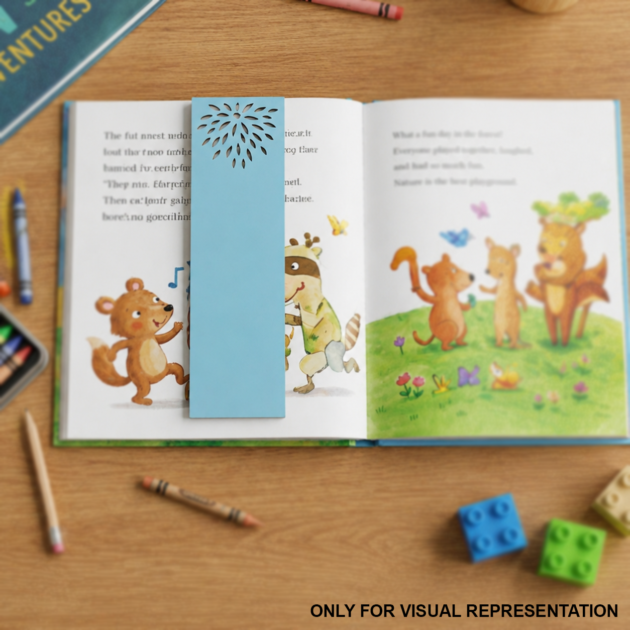 Open book with MDF DIY bookmark of animals on a wooden surface with crayons and blocks.
