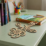 MDF DIY  cutout with 'Health' on a desk with books and a Gruffalo book.