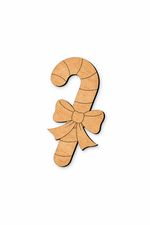Unpainted DIY MDF candy cane cutout with engraved bow and stripe for painting
