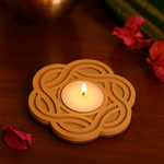 Mdf tealight candle holder  with a lit candle on a wooden surface.