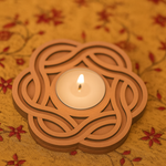 Tea light candle in a Mdf tealight candle holder  holder on a floral fabric background