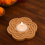 MDF candle holder with a lit candle on a wooden surface