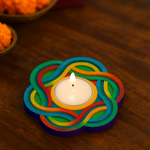 Mdf tealight candle holder with a lit candle on a wooden surface