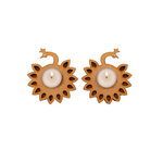 Two mdf candle holders with cut-out designs on a white background