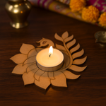 Decorative mdf candle holder with a lit candle on a wooden surface