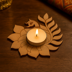 Candle in a decorative mdf holder shaped like a lotus on a wooden surface