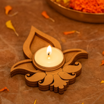 mdf candle holder with a lit candle on a brown background