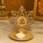 mdf decorative candle holder with star design and 'Om' symbol, featuring a lit candle on a wooden base.