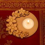 MDF tealight candle holder with a lit candle on a red fabric background