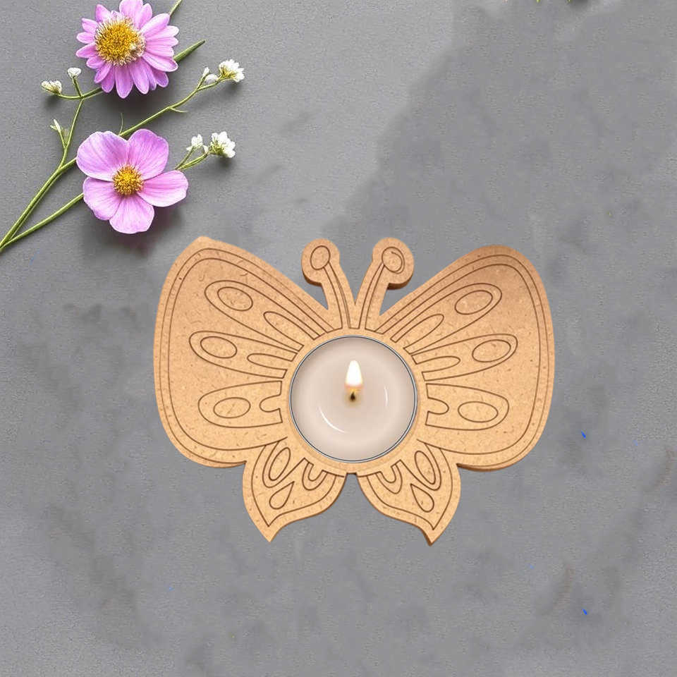 MDF butterfly tealight candle holder with premarked design and lit tealight in center on grey background with fresh flowers