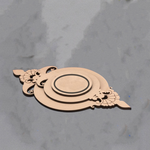 Unpainted MDF crowned circle tealight holder with premarked detailing, ready for DIY decoration on a grey surface