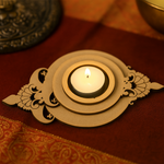 Decorative mdf candle holder with intricate designs on a warm-toned surface