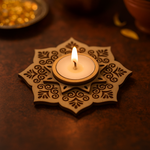 Decorative MDF candle holder with a lit candle on a dark surface
