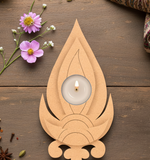MDF Tealight candle holder with a lit candle on a wooden surface with flowers and spices.