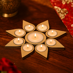 MDF tealight candle holder with lit candles on a wooden surface
