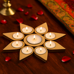 Star-shaped MDF candle holder with candles on a wooden surface with red petals.