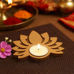 MDF tealight candle holder shaped like a lotus with a lit candle on a textured surface.