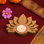MDF tealight lotus-shaped candle holder with a lit candle on a red fabric background.