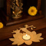 MDF Krishna ji's hands shape tealight candle holder  with a lit candle, placed on a wooden surface.