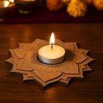 Candle in a decorative paper holder on a wooden surface