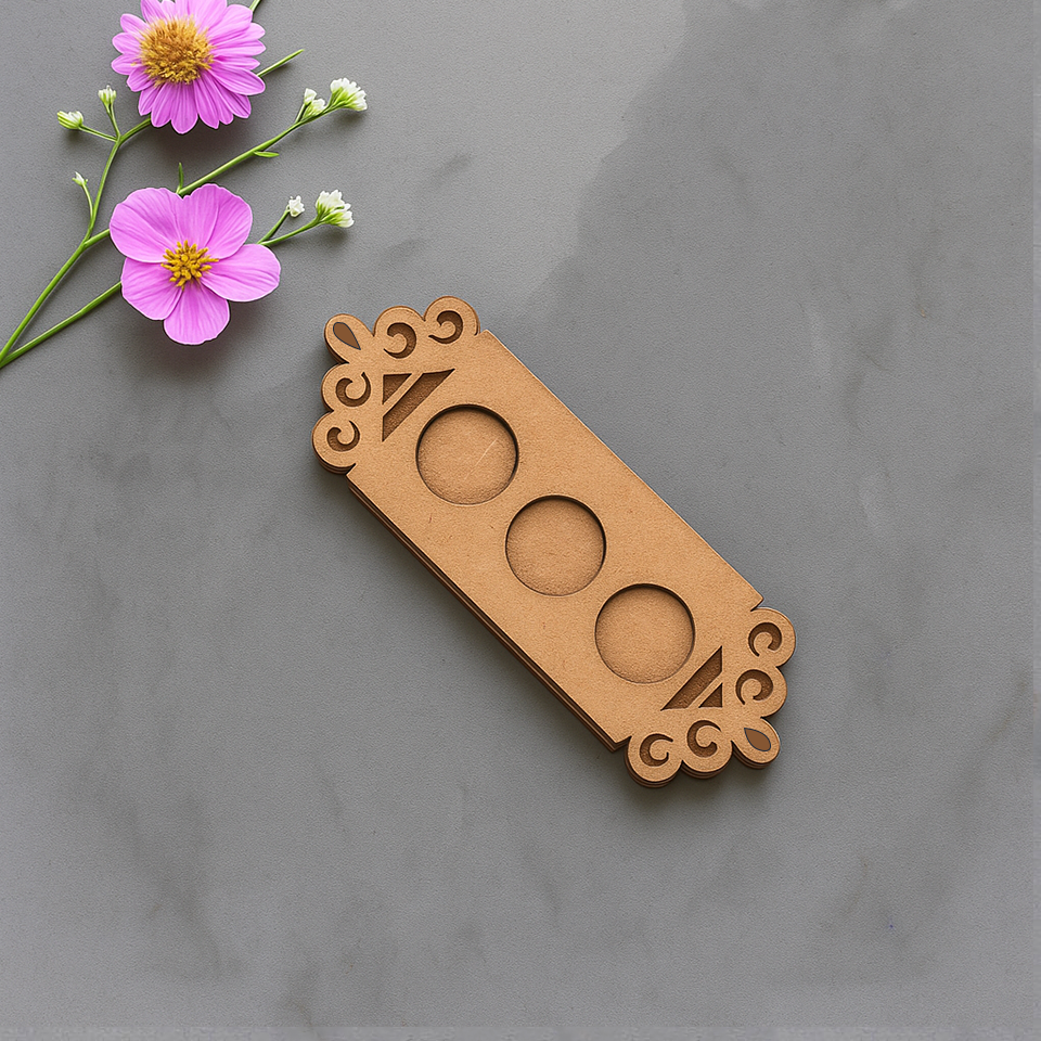 MDF floral border t-light holder with three empty slots on marble surface with flowers