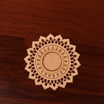 Decorative MDF mandala on a wooden surface