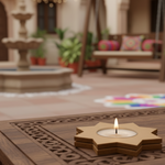 DIY MDF Star-shaped candle holder with a lit candle on a decorative table in an outdoor setting.