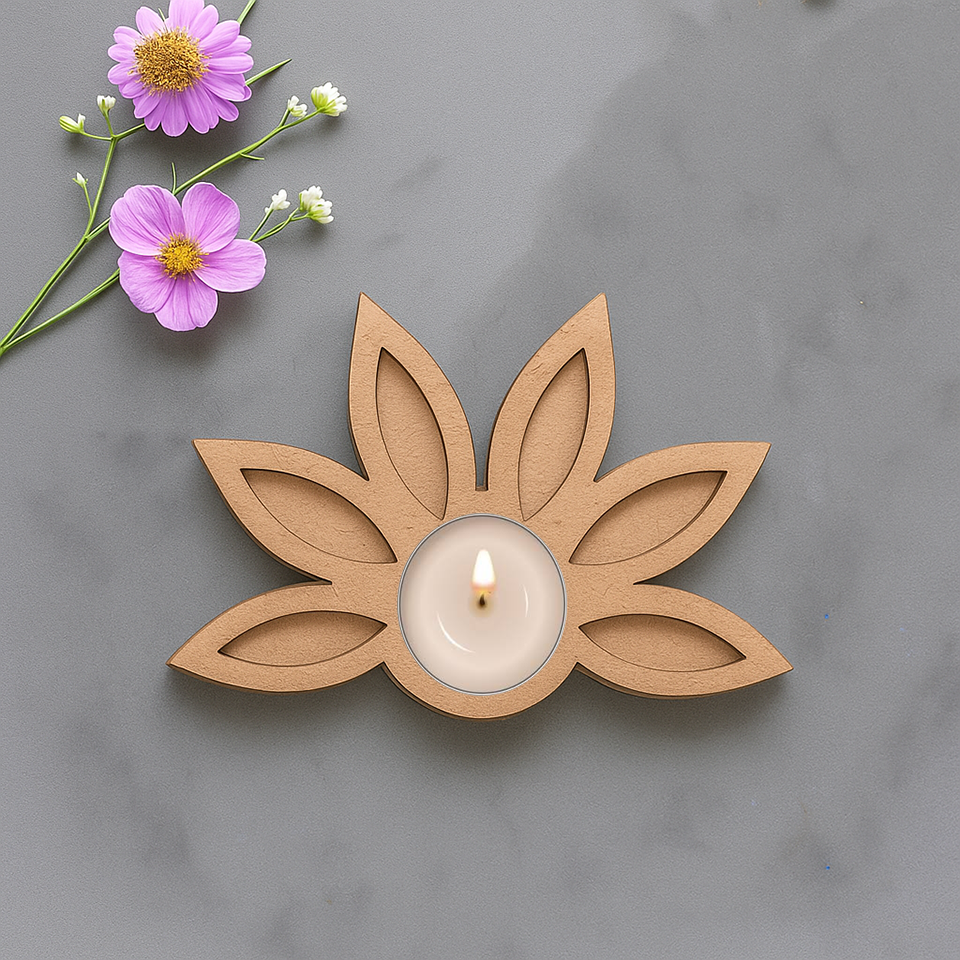 Lotus shape MDF tea light candle holder with lit candle and floral decoration on marble surface