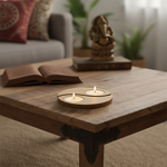 Wooden table with a mdf yin yang candle holder holding two candles, in a cozy living room setting.