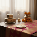 Decorative table setting with candles, decorative items, and a pink and gold tablecloth with mdf tealight candle holder.