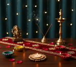 Decorative setup with candles, incense sticks, and a statue on a wooden table with a dark background with mdf tealight candle holder.